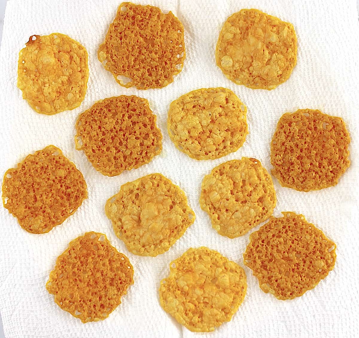12 Keto Baked Cheese Crisp Crackers on paper towels