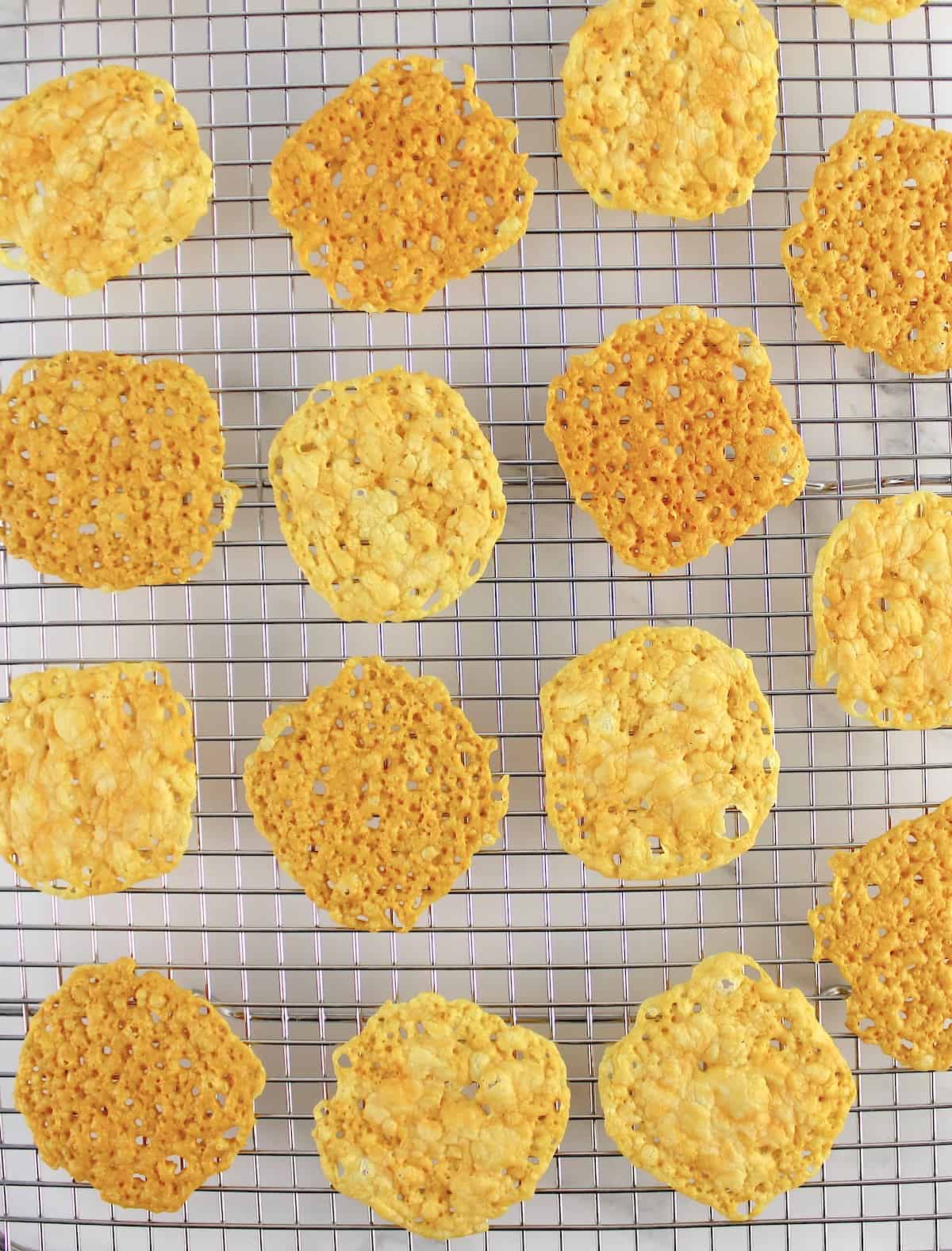 Keto Baked Cheese Crisp Crackers on cooling rack