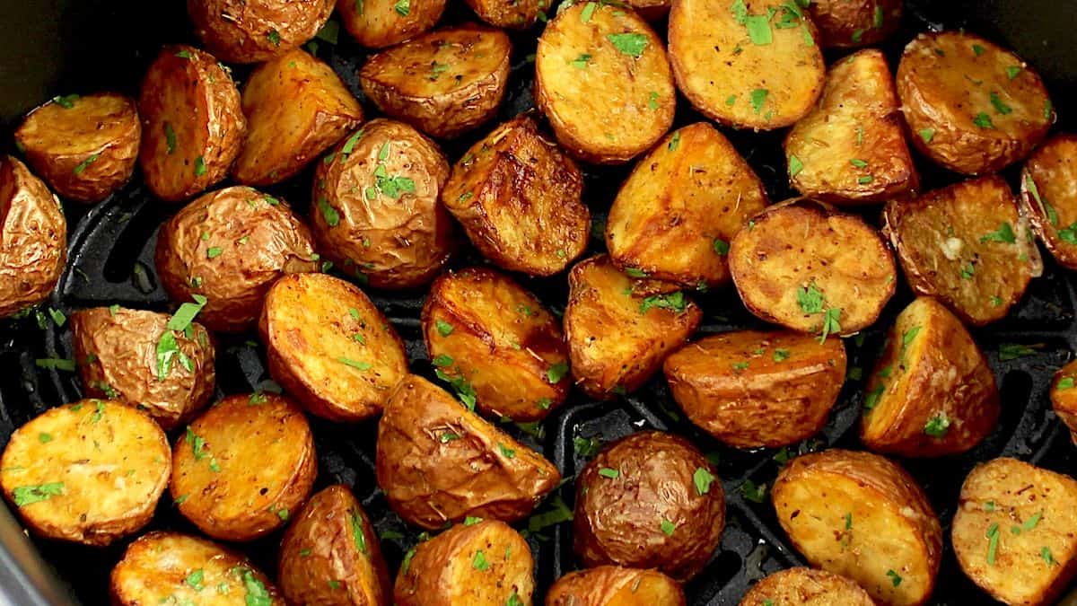 closeup of Air Fryer Potatoes in air fryer basket