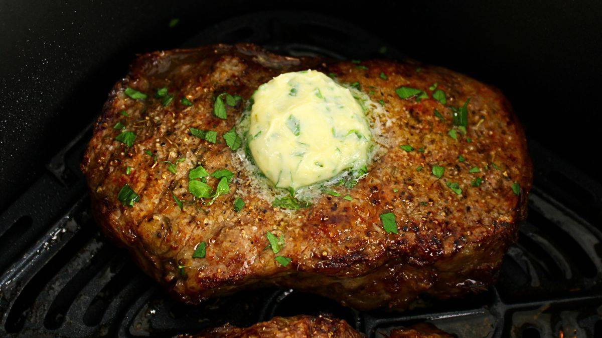 Air Fryer Steak with herbed butter on top