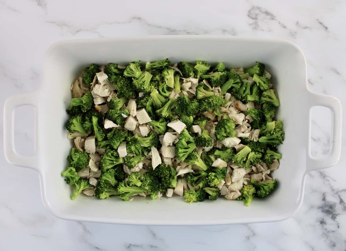 chopped chicken and broccoli in white casserole