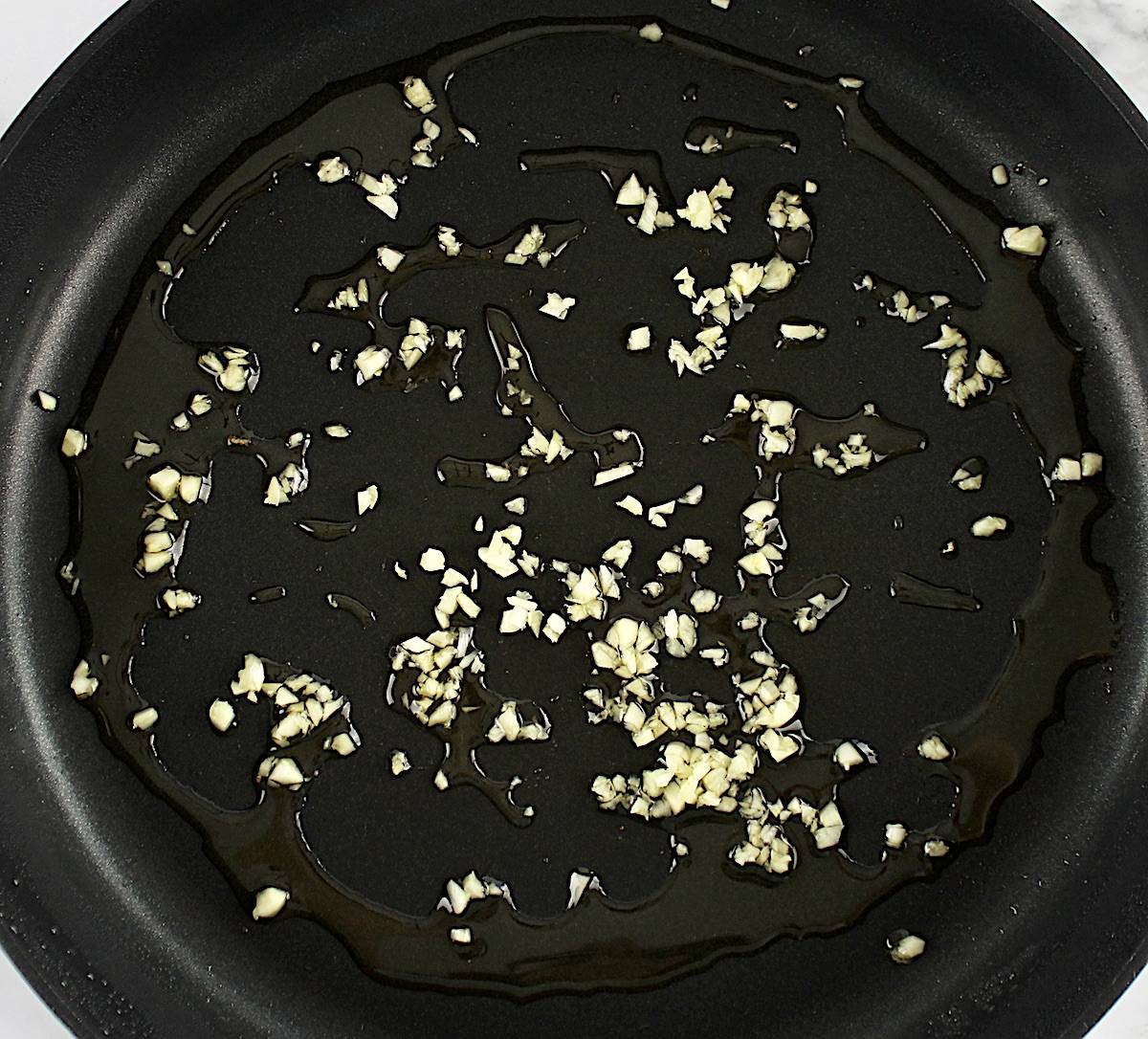 minced garlic in olive oil in skillet