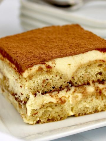 slice of keto tiramisu on white plate