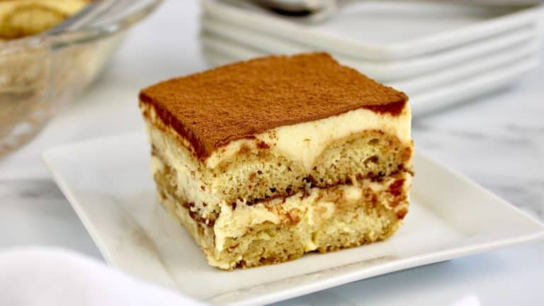 slice of keto tiramisu on white plate