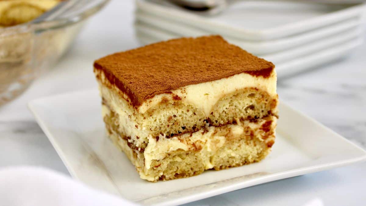 slice of keto tiramisu on white plate 