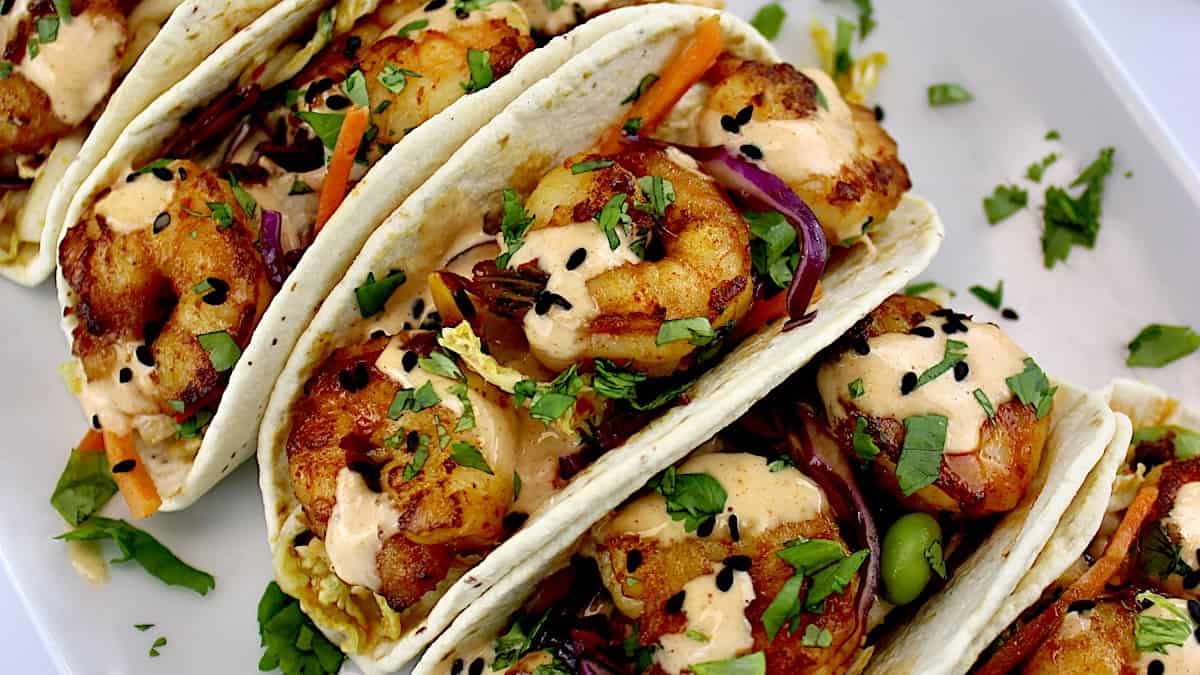 Asian Shrimp Tacos with sauce drizzled over top