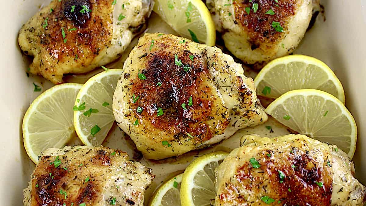 closeup of Baked Chicken Thighs with lemon slices