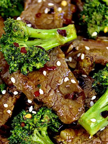 closeup of Beef and Broccoli with red pepper flakes on top