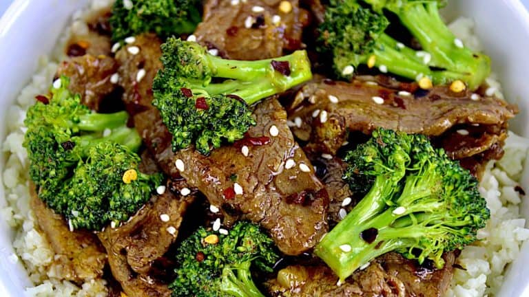 closeup of Beef and Broccoli with red pepper flakes on top