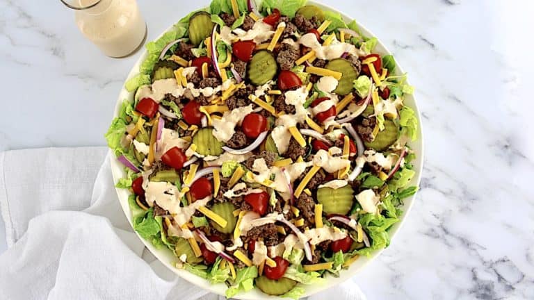overhead view of Big Mac Cheeseburger Salad in beige bowl