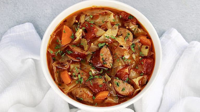 overhead view of Cabbage Soup with Sausage with chopped parsley