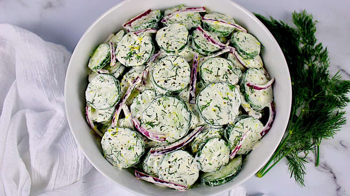 Creamy Cucumber Salad in white bowl