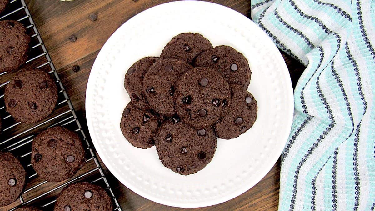 overhead view of keto double chocolate chip cookies on white plate