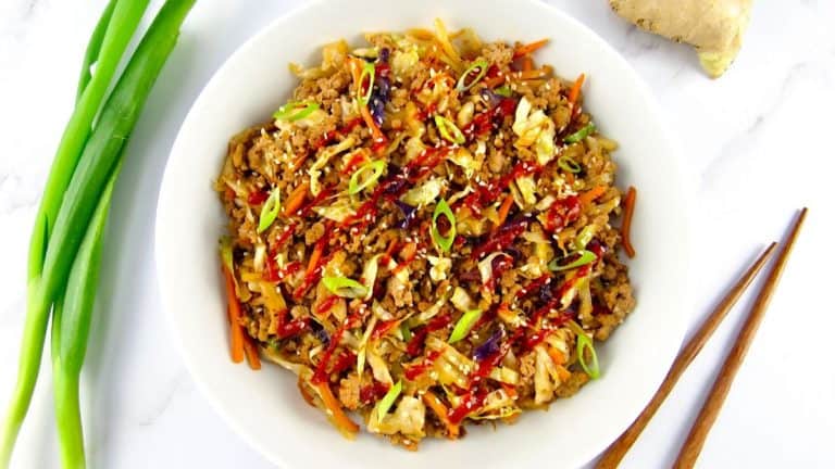 Egg Roll in a Bowl in a white bowl with scallions on side
