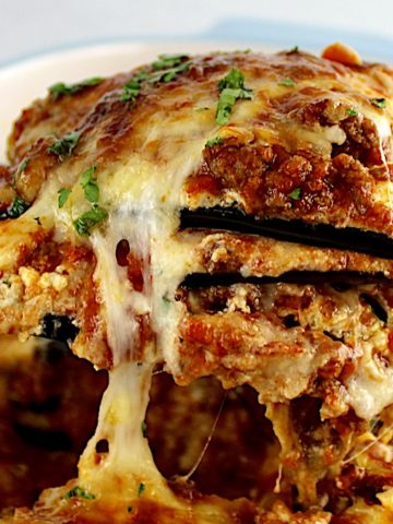 closeup of Eggplant Lasagna slice being lifted out of casserole