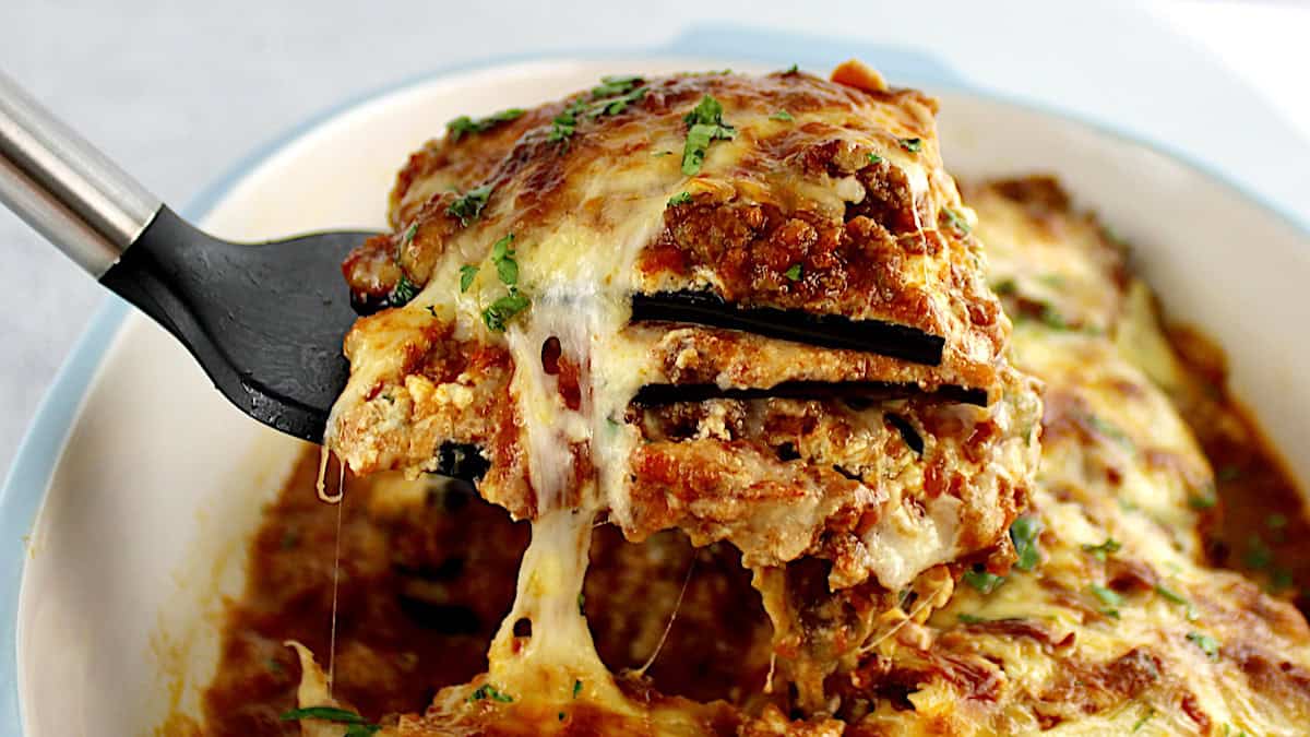 closeup of Eggplant Lasagna slice being lifted out of casserole