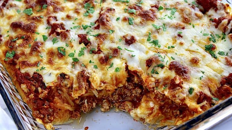 Italian Spaghetti Squash Casserole closeup with some missing from glass casserole