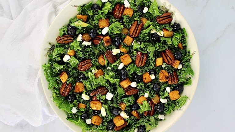 overhead view of Kale Salad with Roasted Butternut Squash in white bowl