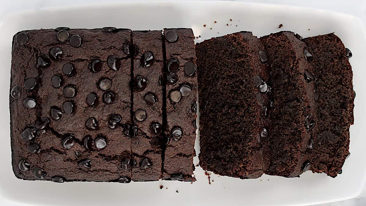 overhead view of Keto Chocolate Zucchini Bread sliced on white plate