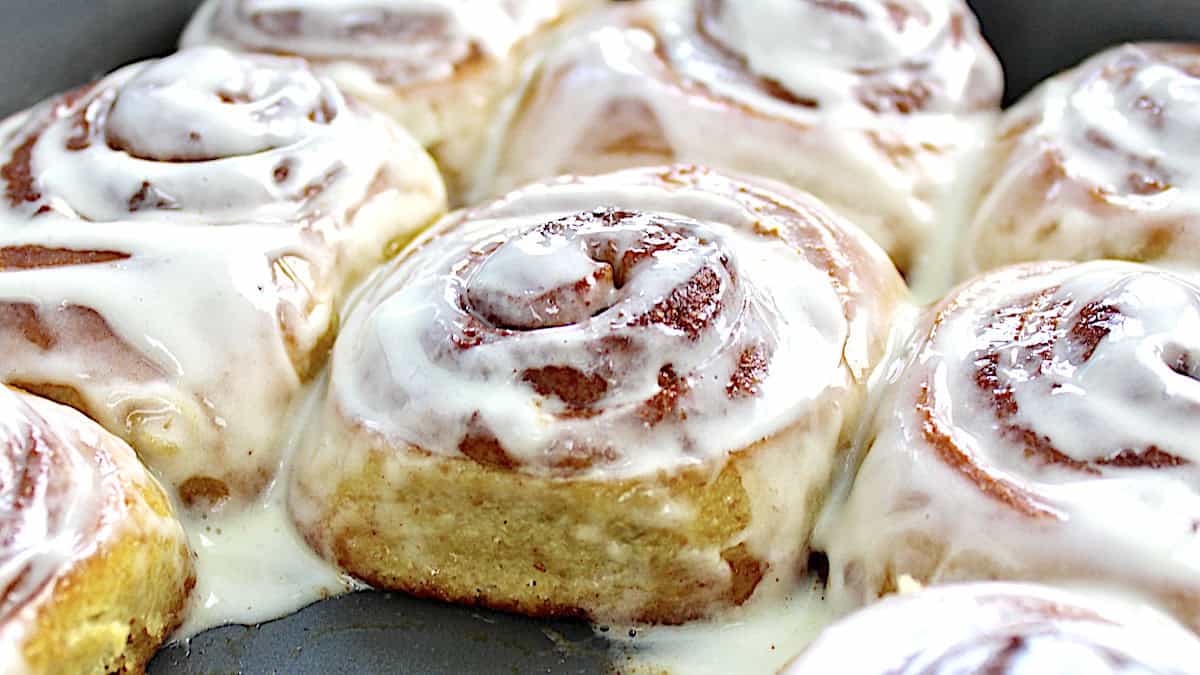 Keto Cinnamon Rolls in baking pan with icing on top