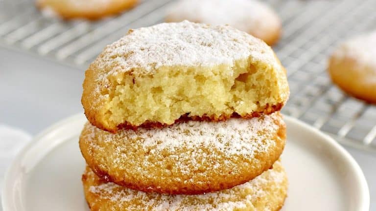 stacked keto cream cheese cookies with bite missing off top cookies