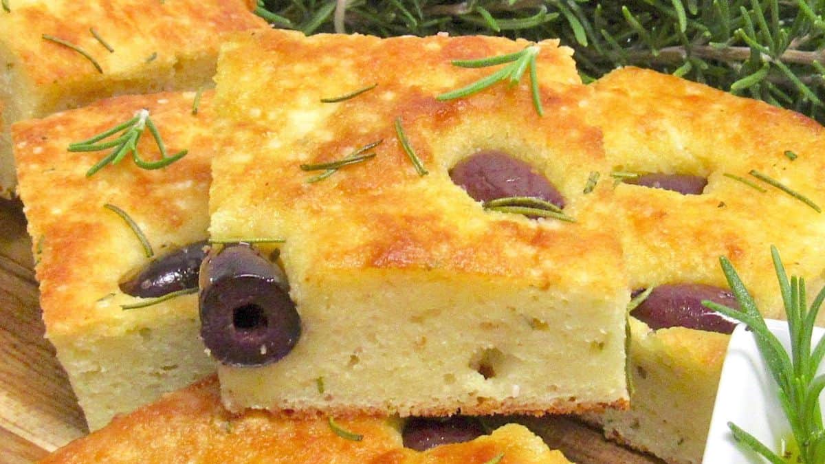 closeup of slice of Keto Focaccia with olives and rosemary