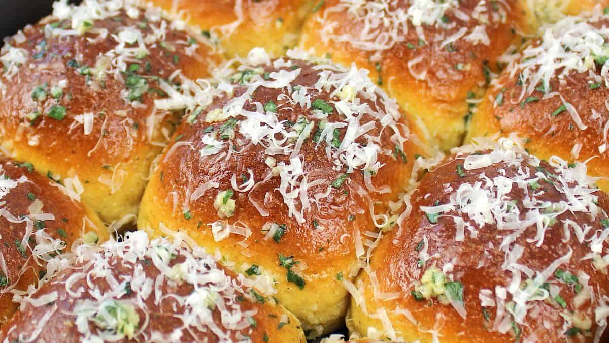 closeup of Keto Garlic Rolls with grated parmesan on top