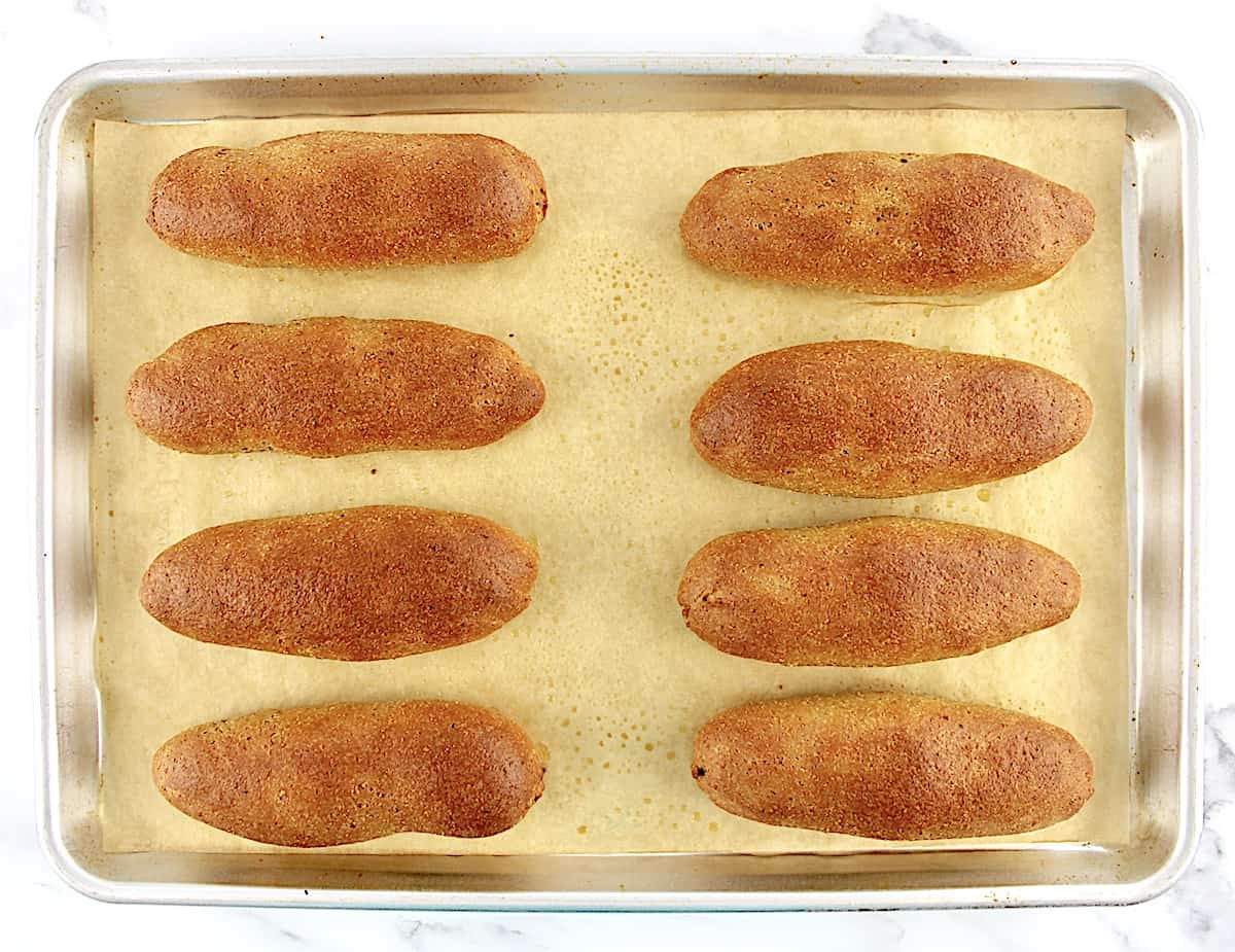 8 Keto Hot Dog Buns on baking sheet lined with parchment paper