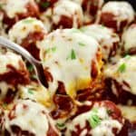 closeup of Keto Italian Meatball in spoon with cheese pull