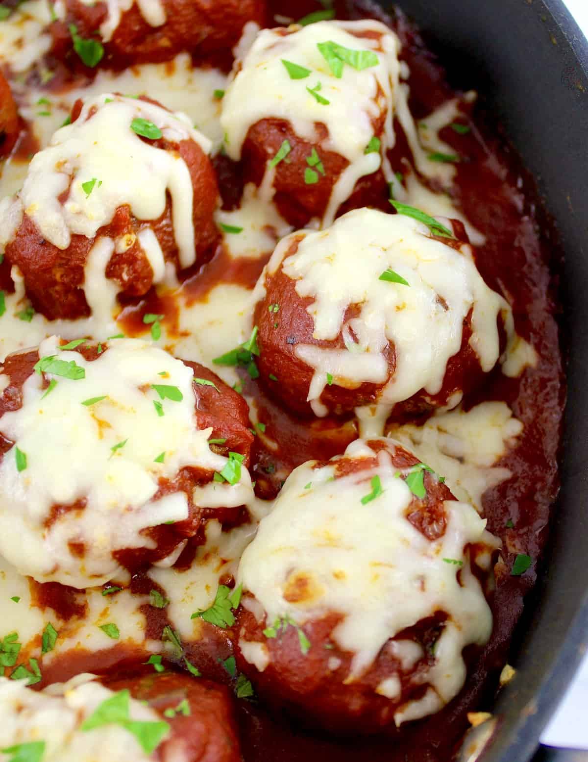 Keto Italian Meatballs with cheese on top in skillet