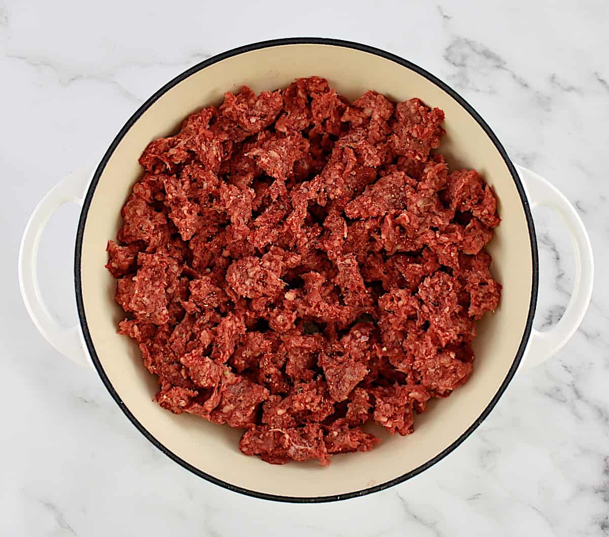 raw ground beef in skillet
