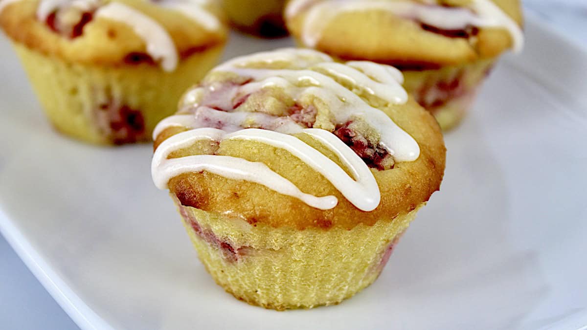 closeup of Keto Strawberry Lemonade Muffin on white plate