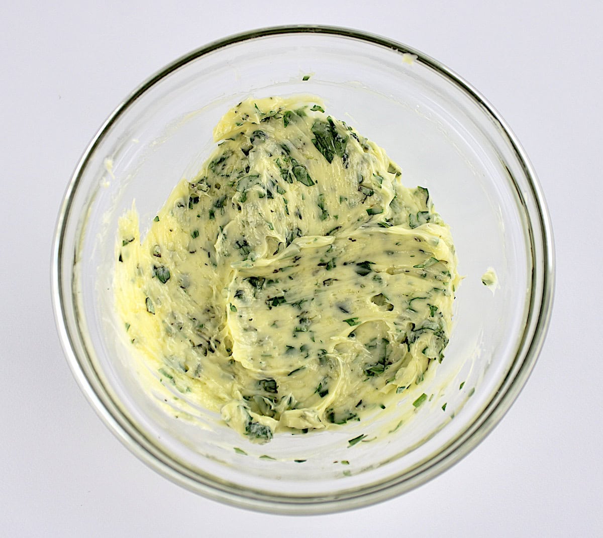 compound herb butter in glass bowl