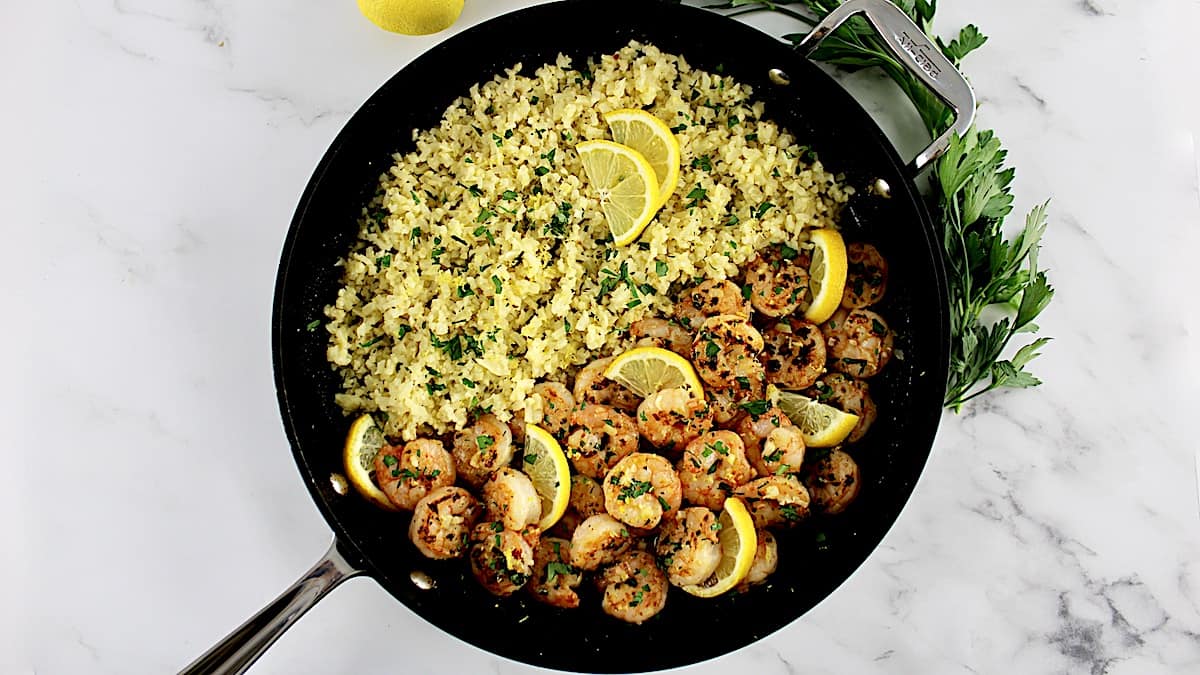 Shrimp Scampi with Cauliflower in skillet with lemon slices