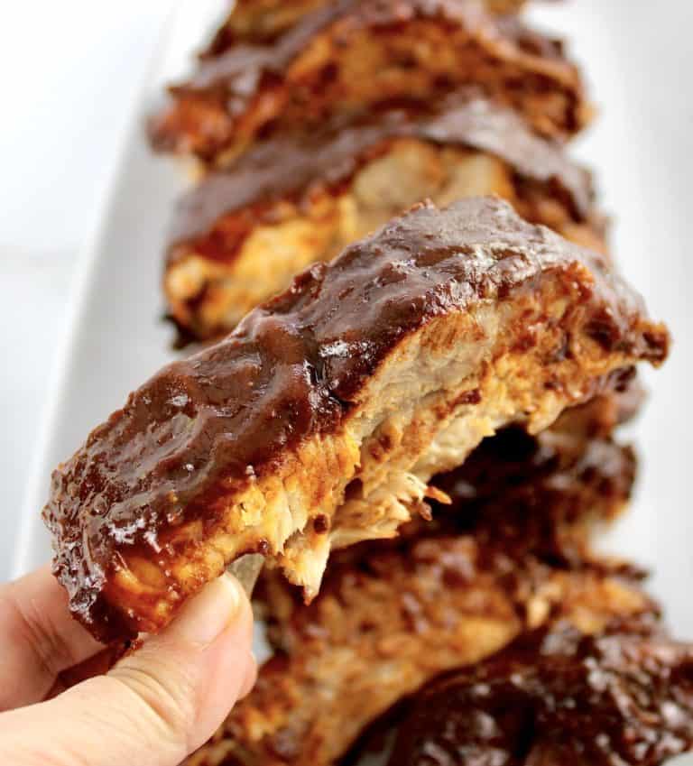 Slow Cooker Baby Back Rib being held up