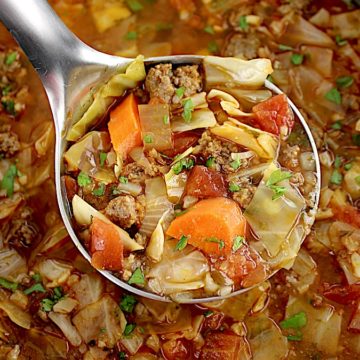 Slow Cooker Cabbage Roll Soup in silver ladle