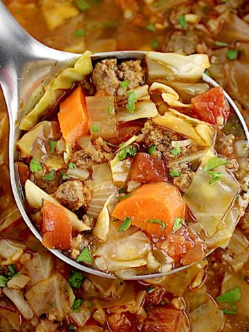 Slow Cooker Cabbage Roll Soup in silver ladle