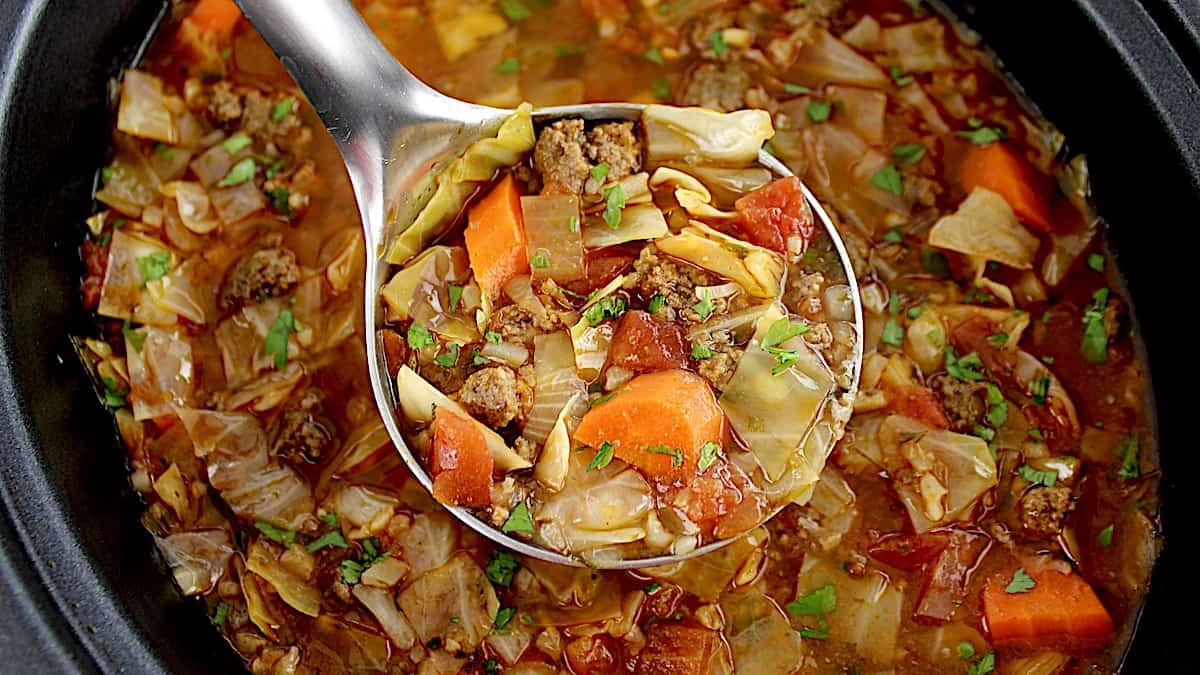 Slow Cooker Cabbage Roll Soup in silver ladle