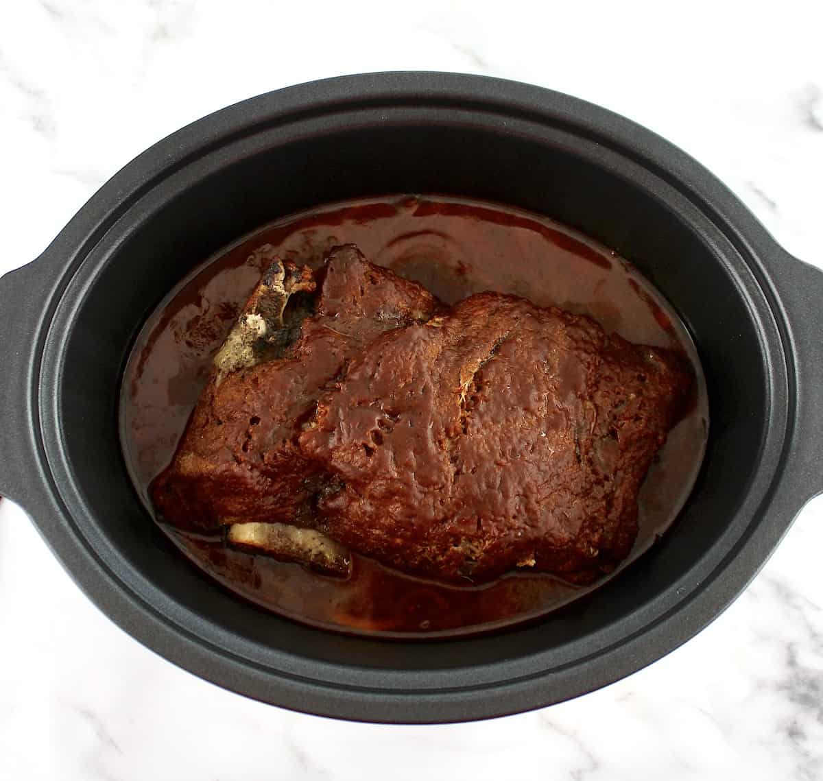 cooked bbq pork shoulder in slow cooker