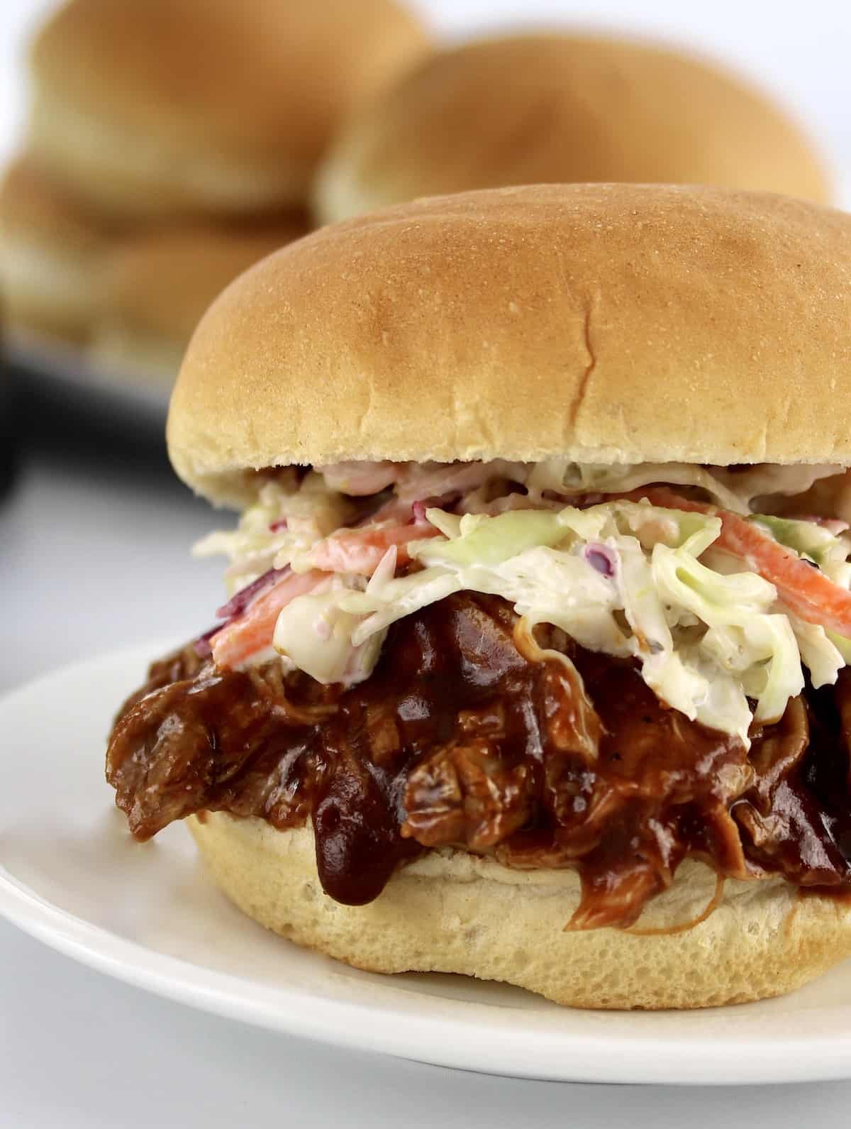 closeup of pulled pork sandwich with coleslaw