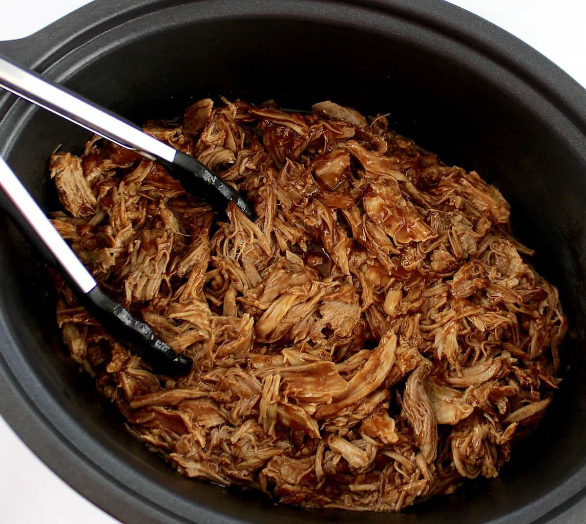 Slow Cooker Pulled Pork with tongs