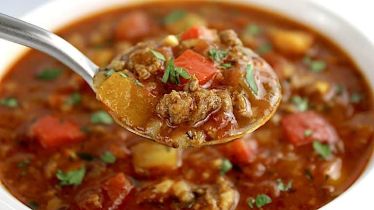 Stuffed Pepper Soup with spoonful over soup bowl