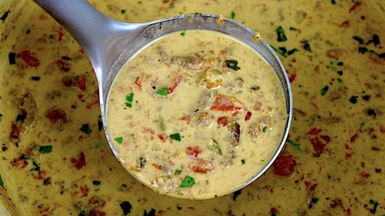 Taco Soup in ladle with chopped parsley