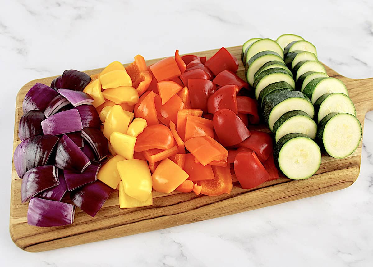sliced zucchini, red onion, red, yellow and orange bell peppers cut into chunks