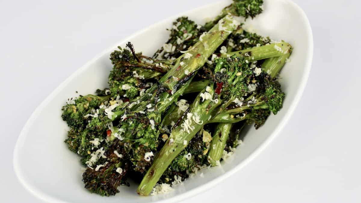 Grilled Broccolini on white dish