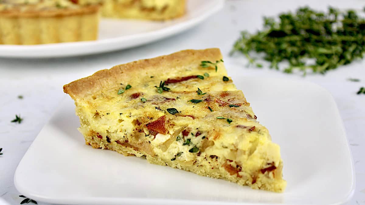 Keto Quiche Lorraine slice on white plate