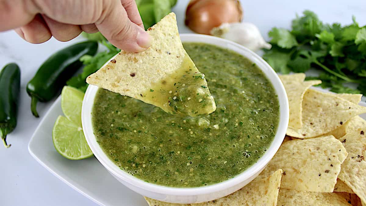 Salsa Verde with chip being dipped in