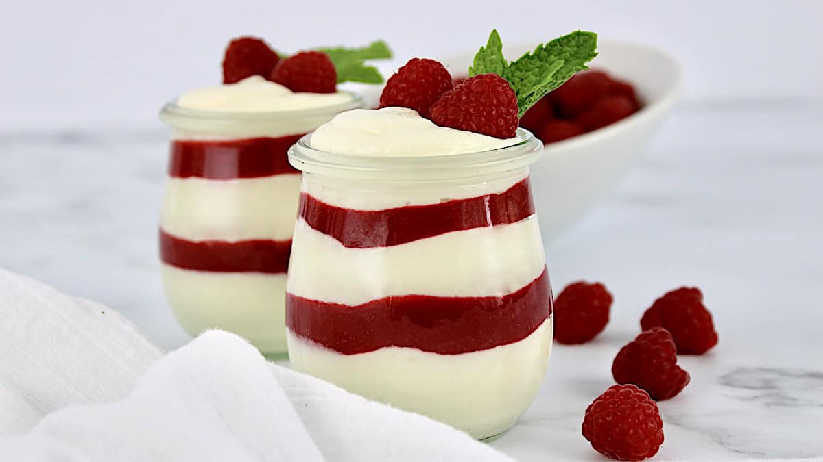 White Chocolate Raspberry Mousse in open glass jars