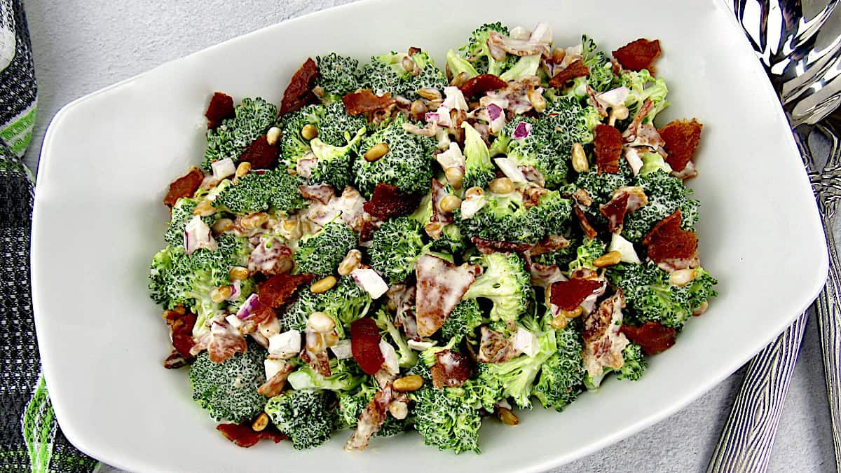 closeup of broccoli salad in white bowl