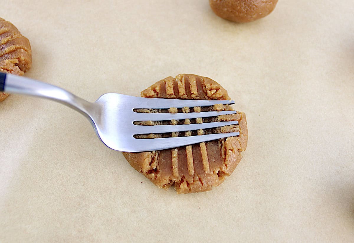 Easy Peanut Butter Cookie being pressed with fork on top